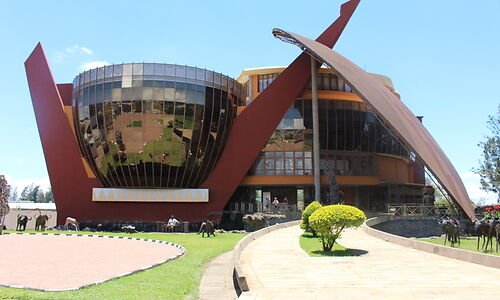 Modern landmark building with sculptural arches in Arusha