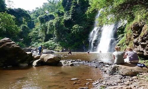 Visitors at the pool below a Marangu waterfall